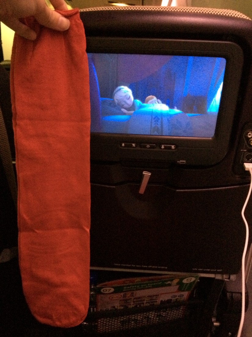 In the kit were socks to keep my footsies warm (and yes, that's Frozen playing on the screen, and no, I did not care for it).