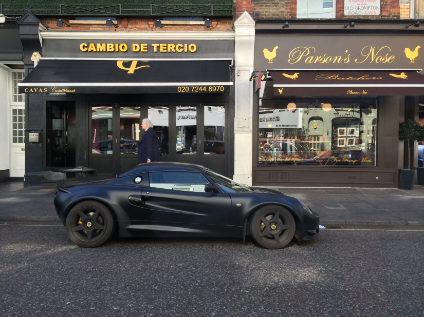 This was a cool-looking Batman-type car, a cool butcher shop name, and some store in Spanish, all in one picture.