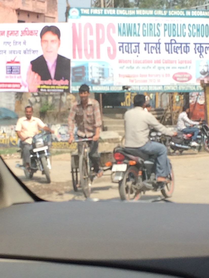 Motorized bicycles and scooters dashed in ad out of traffic.