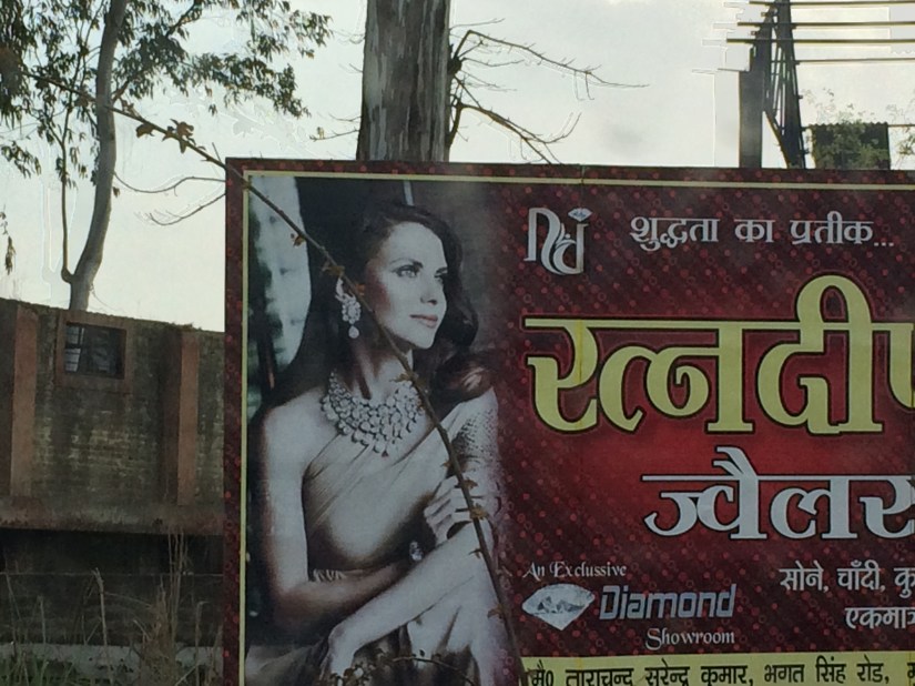 Most women in India never showed their shoulders.  But I guess it was okay for advertising?